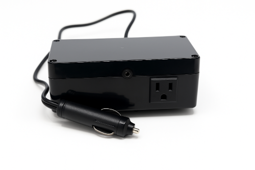 Black power adapter with plug on a white background